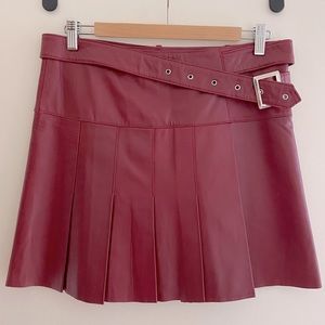 Red leather pleated skirt